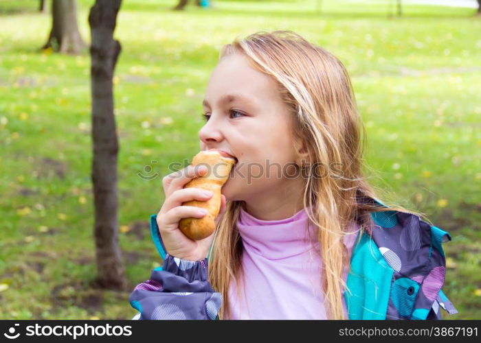 Photo of eating cute girl with blond hair