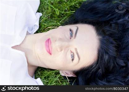 Photo of European woman on green grass