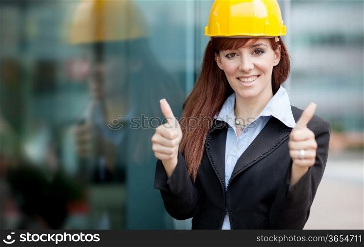 photo of female constructor with blueprints