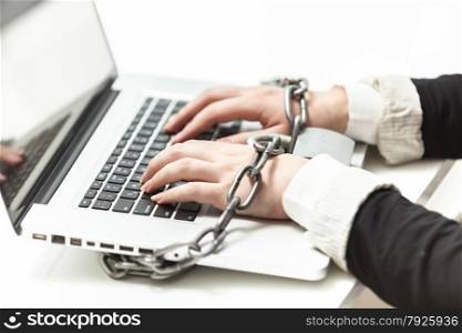 Photo of female locked to laptop by chain