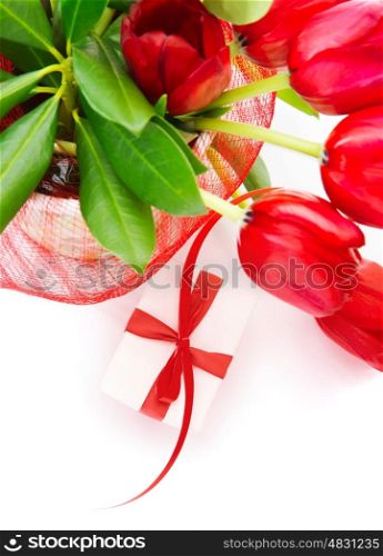 Photo of festive border, red fresh tulips bouquet in the pot, small white gift box with red ribbon, isolated on white background, home decoration, floral bunch for mothers day, romantic holiday