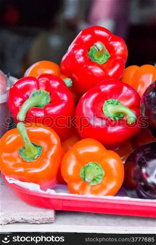 Photo of five fresh red raw pepper