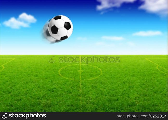 Photo of football ball in motion, grass field stadium, team sport background