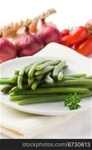 photo of french beans on white isolated background with different vegetables around