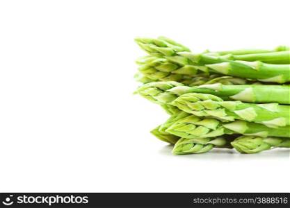 Photo of fresh asparagus over white isolated background