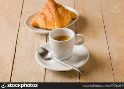 photo of fresh coffee and croissants on brown wooden table