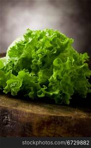photo of fresh green lettuce on wooden table