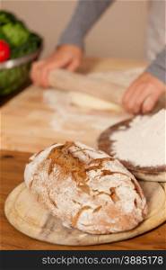 Photo of fresh homemade bread over wooden table