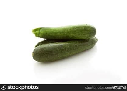 photo of fresh zucchini on white isolated background