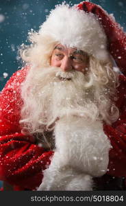 Photo of frozen Santa Claus outdoors in snowfall at north pole at night