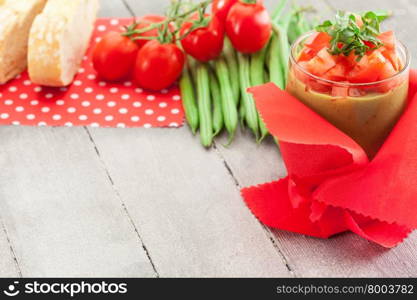 Photo of gazpacho over wooden table