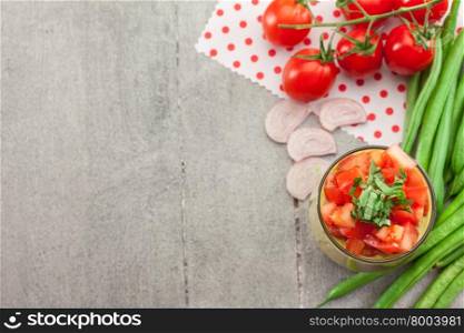 Photo of gazpacho over wooden table