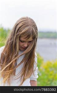 Photo of girl playing with long hair