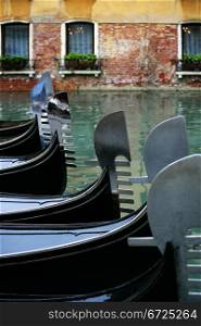 Photo of gondolas waiting for tourists in Venice Italy.