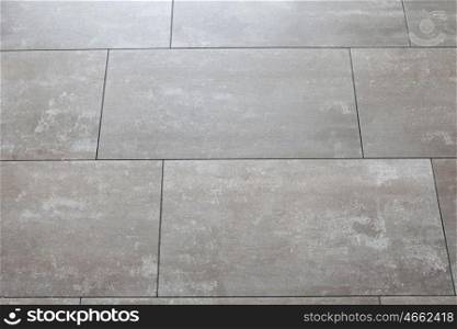 Photo of grey floors with large tile horizontally