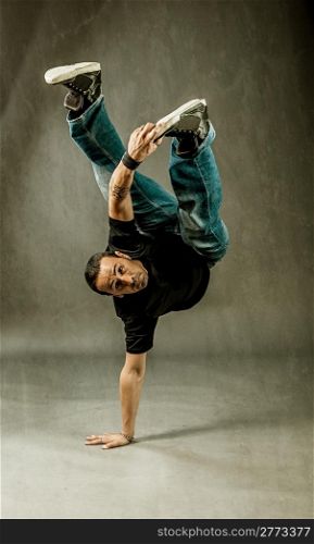 photo of guy performing acrobatical dance movements