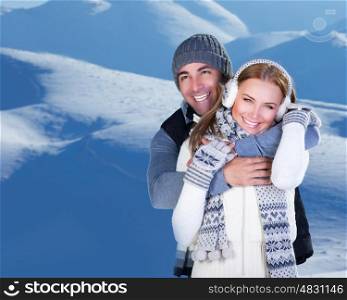 Photo of happy family enjoying winter vacation in snowy mountains, closeup portrait of cheerful smiling couple hugging outdoor in cold weather, romantic date, affection and happiness concept