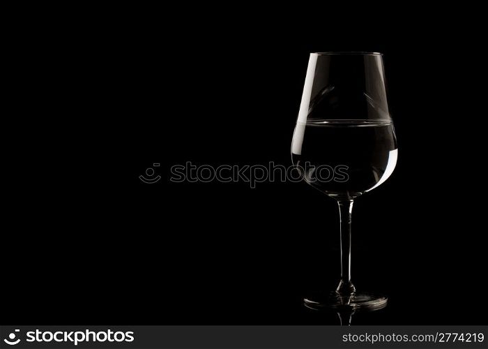 photo of highlighted wine glass edges on black background