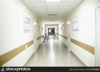 Photo of hospital corridor interior without sicks. Hospital corridor interior without sicks