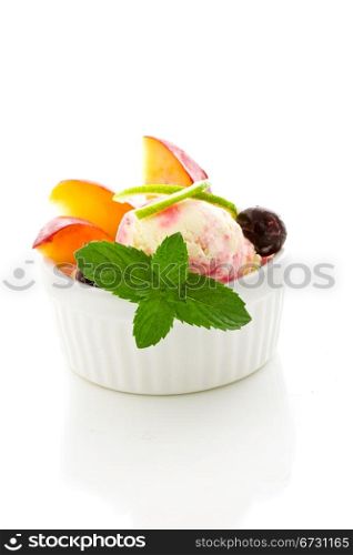 photo of Ice cream with fruits on isolated white background