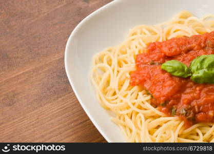 photo of italian pasta with tomatoe sauce and basil