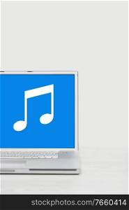 Photo of laptop with music sign