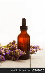 photo of lavender essential oil over wooden table
