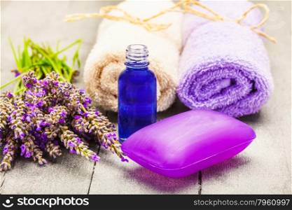Photo of lavender soap and oil over wooden table
