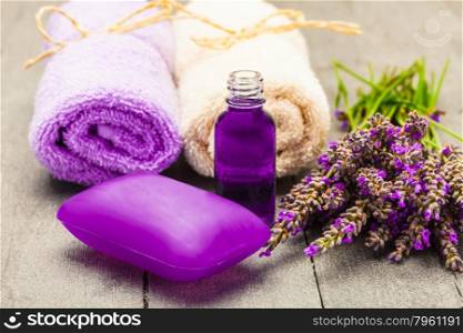 Photo of lavender soap and oil over wooden table