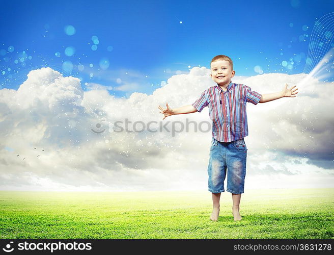 Photo of little boy jumping and raising hands