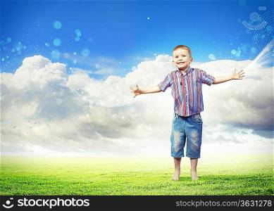 Photo of little boy jumping and raising hands