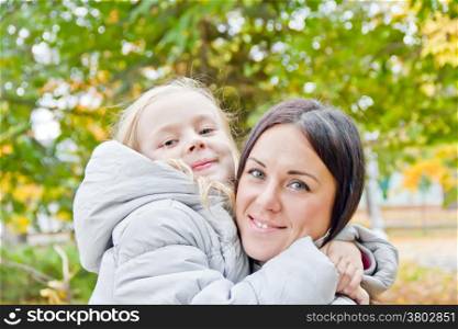 Photo of mother and daughter in autumn