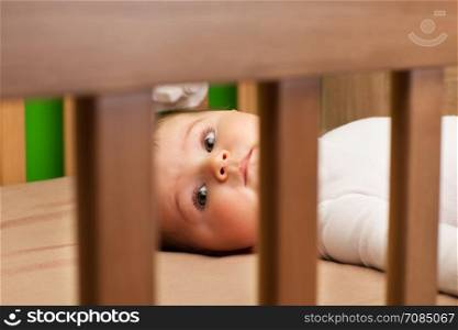 Photo of newborn girl in bed