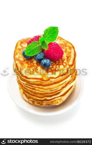 Photo of pancakes with berries over white isolated background