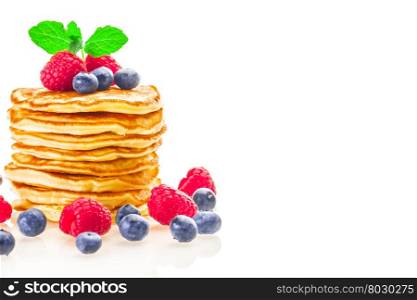Photo of pancakes with berries over white isolated background