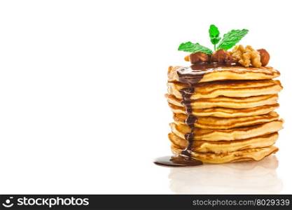 Photo of pancakes with chocolate and nuts over white isolated background