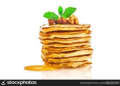 Photo of pancakes with honey over white isolated bachground