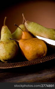 photo of pears on an old plate in poor art style