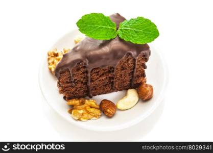 Photo of piece of chocolate cake over white isolated background