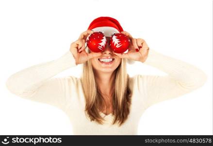 Photo of pretty blond girl wearing santa claus hat isolated on white background, cute woman holding two red cristmas toy in hands, new year party, holiday celebration, happiness concept