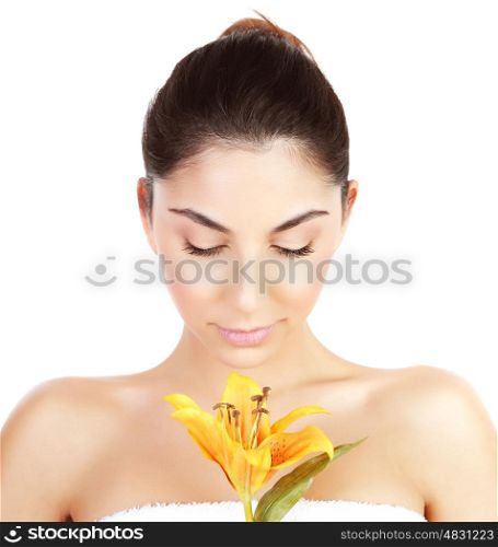 Photo of pretty woman enjoying dayspa, closeup portrait of attractive female with closed eyes holding yellow lily flower isolated on white background, luxury spa salon, beauty treatment concept