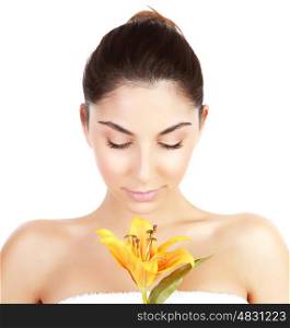 Photo of pretty woman enjoying dayspa, closeup portrait of attractive female with closed eyes holding yellow lily flower isolated on white background, luxury spa salon, beauty treatment concept