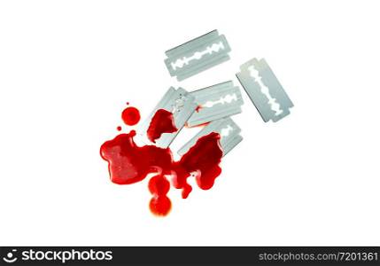 Photo of Razor blade with a drop of blood on white background