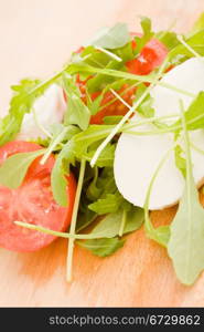 photo of rocket salad with tomatoe and mozzarella