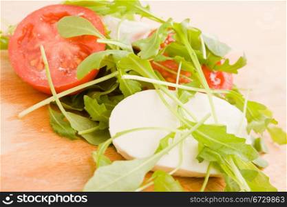 photo of rocket salad with tomatoe and mozzarella