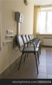 Photo of row chairs in empty corridor