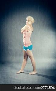 photo of sexy blonde woman dancing with short pants