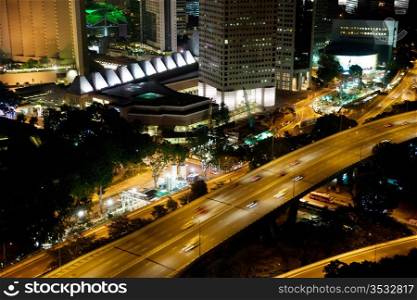 photo of singapore roads and buildings at night