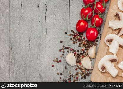 Photo of sliced mushrooms and spices over wooden table