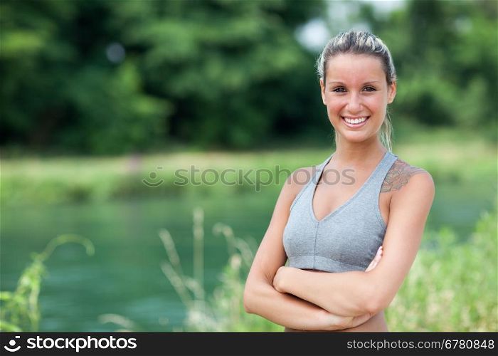 Photo of smiling blonde woman with running outfit